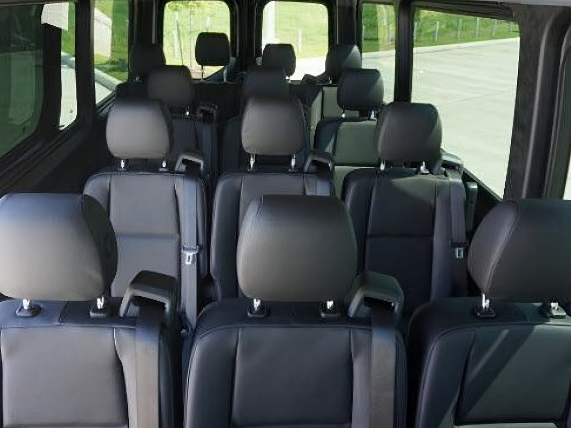 Interior of 14-passenger transit shuttle for cost-effective DFW group airport logistics