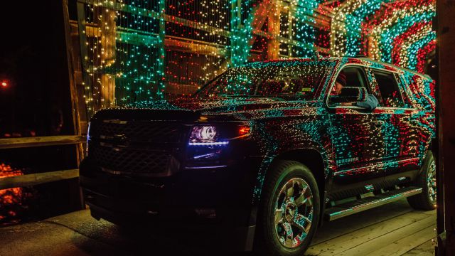 Black SUV with Christmas lights