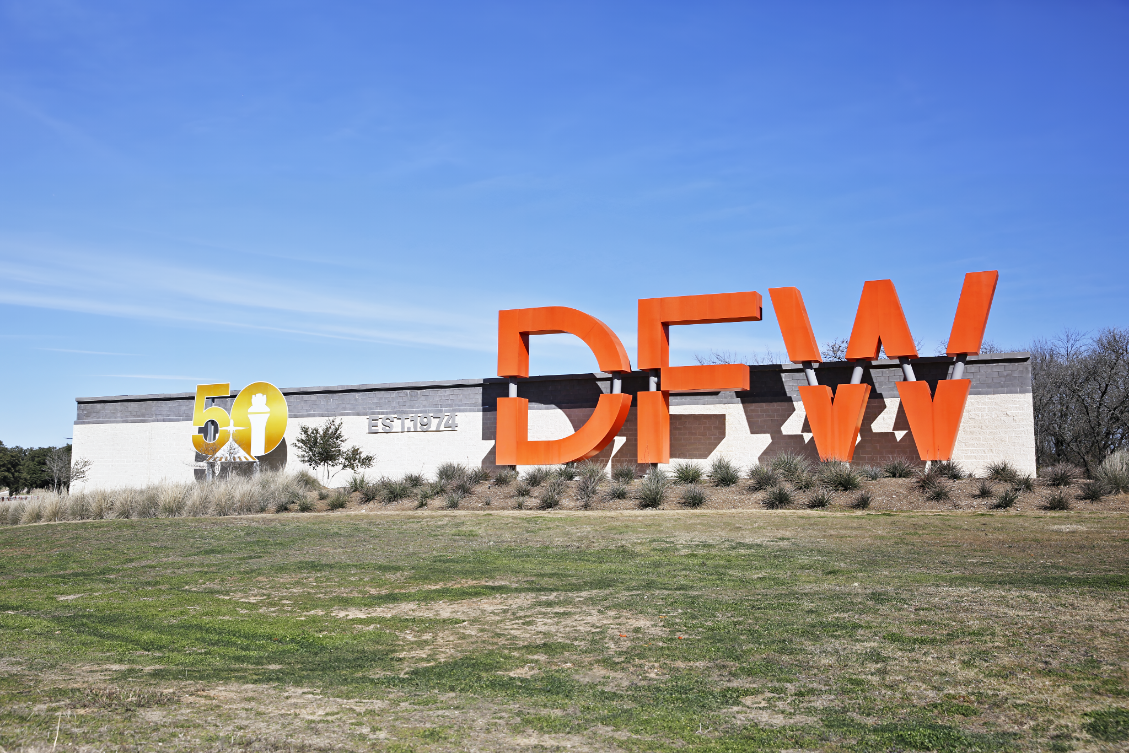 DFW International Airport entrance for pre-arranged Irving Texas Las Colinas airport transportation via SH-114