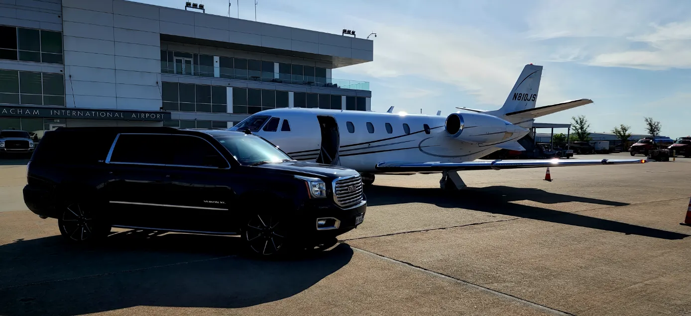 Private tarmac FBO pickup with black GMC Yukon XL at Arlington Municipal Airport GKY for VIP jet-to-stadium transfers Arlington TX